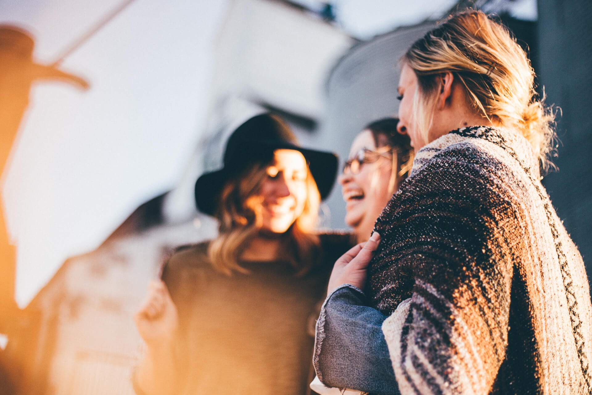 Women standing in a group laughing and smiling